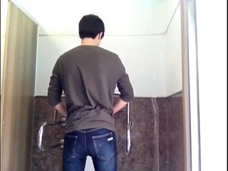 Korean Boy Play With Toy In Public WC