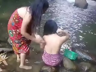 Beautiful girls having bath outdoor